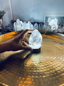 Clear Quartz Crystal Light on Wood Base
