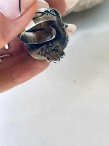 Size 7 adjustable Turquoise and Sterling Silver Ring